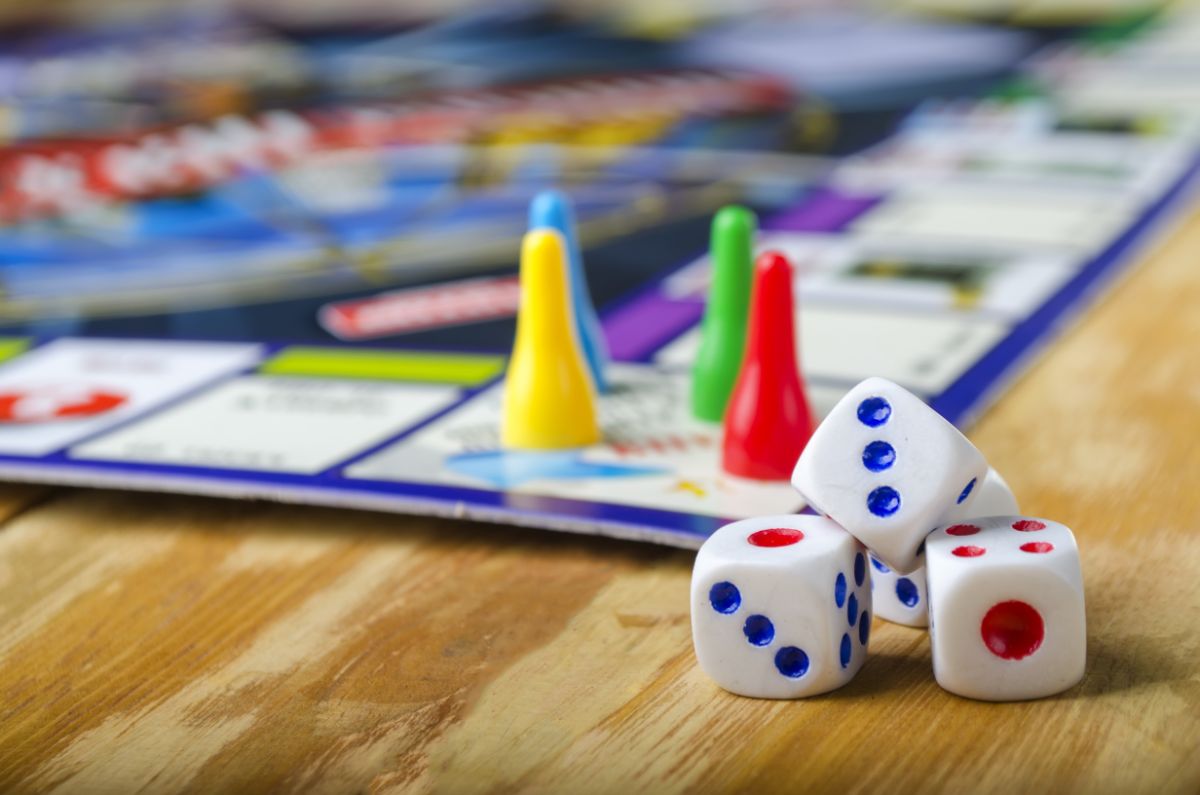 Monopoly board game and 4 dice.