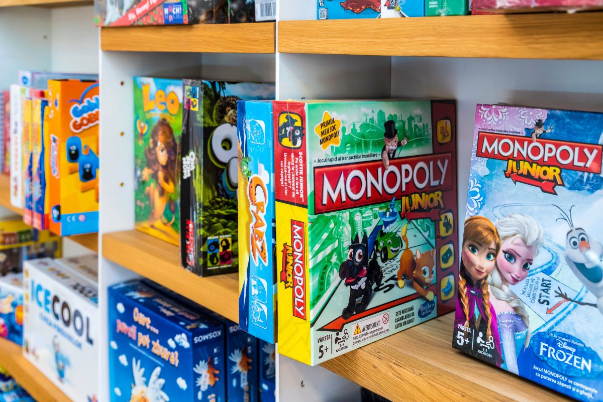 Why are Board Games So Expensive? 5 Monopoly board games sold on a gameshop.