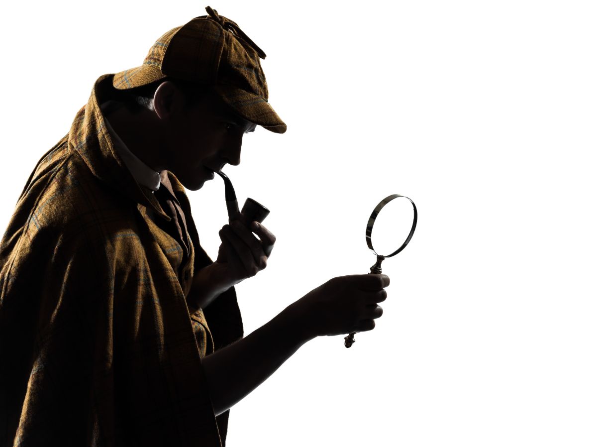 A detective with pipe and magnifying glass.