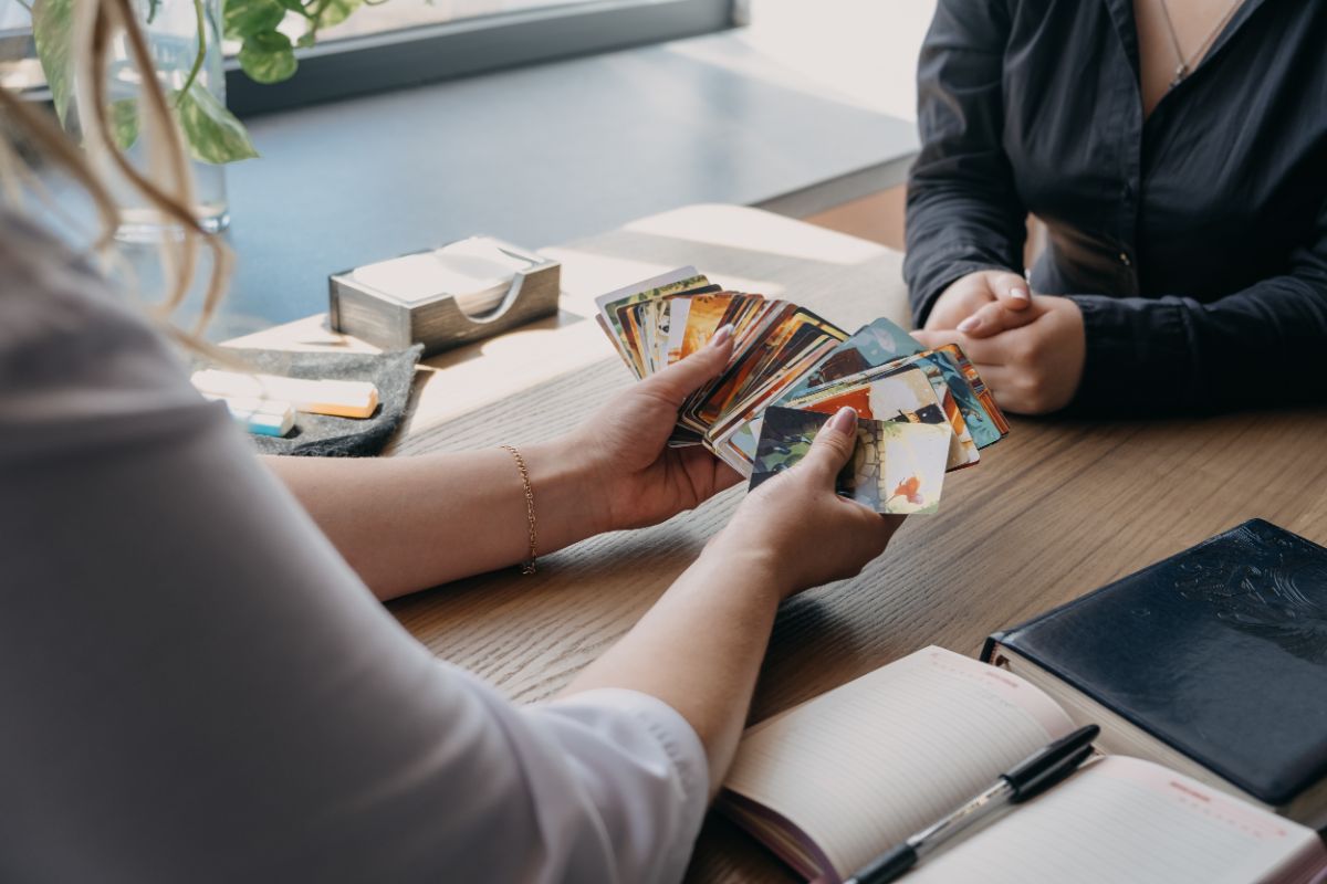 2 Player Card Games: What Card Games Can You Play With 2 People? 6 Two woman playing concentration on the table.
