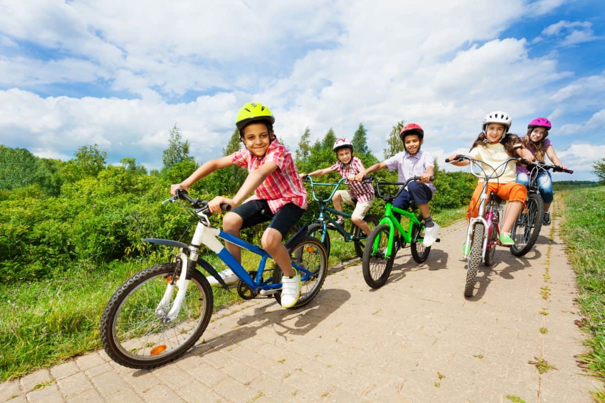 Kids biking outdoors.