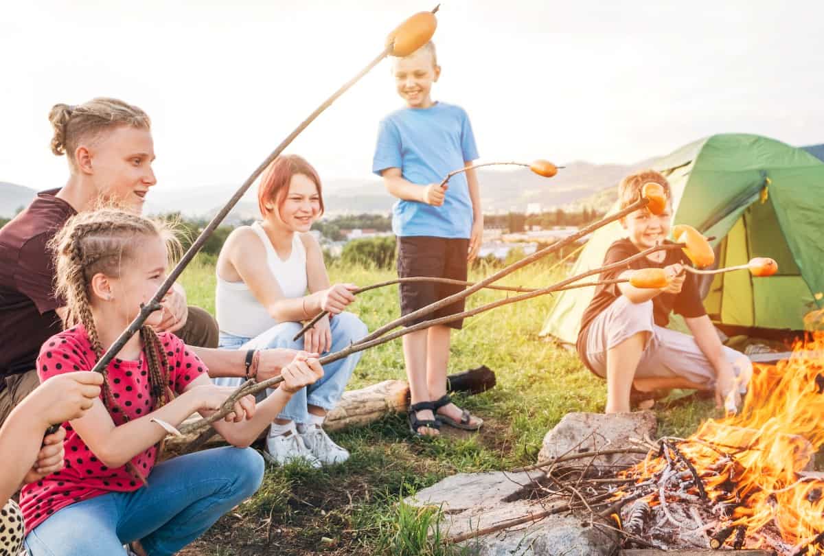 Family spending time in a camp site.