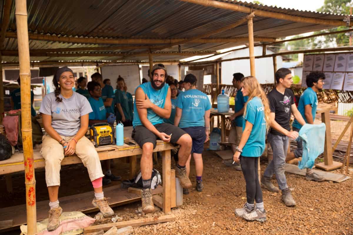Volunteers in a construction site helping rebuild a school.