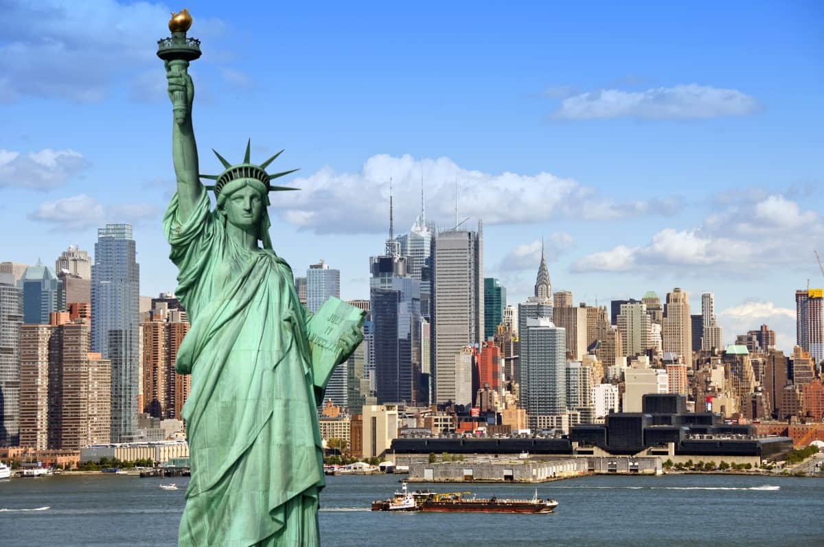 Statue of Liberty against New York cityscape.