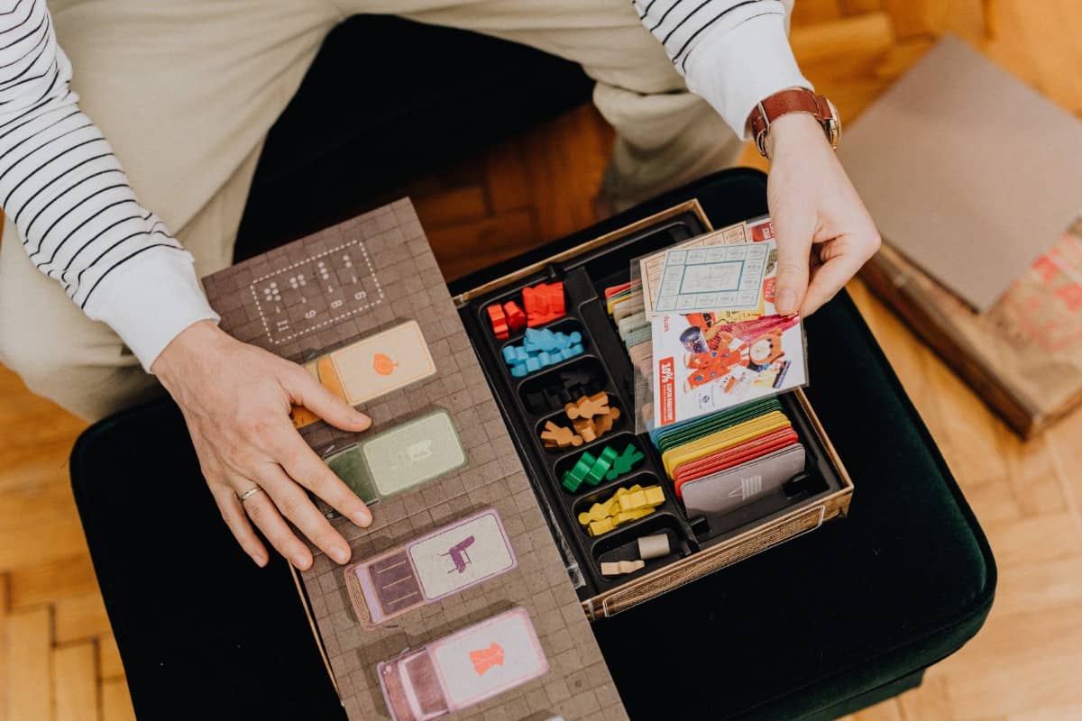 Hands holding game cards.