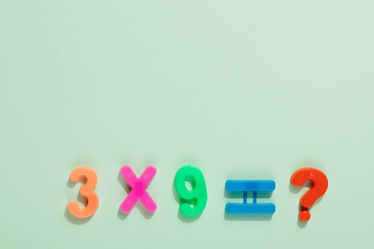 Multiplication equation using colorful plastic numbers.